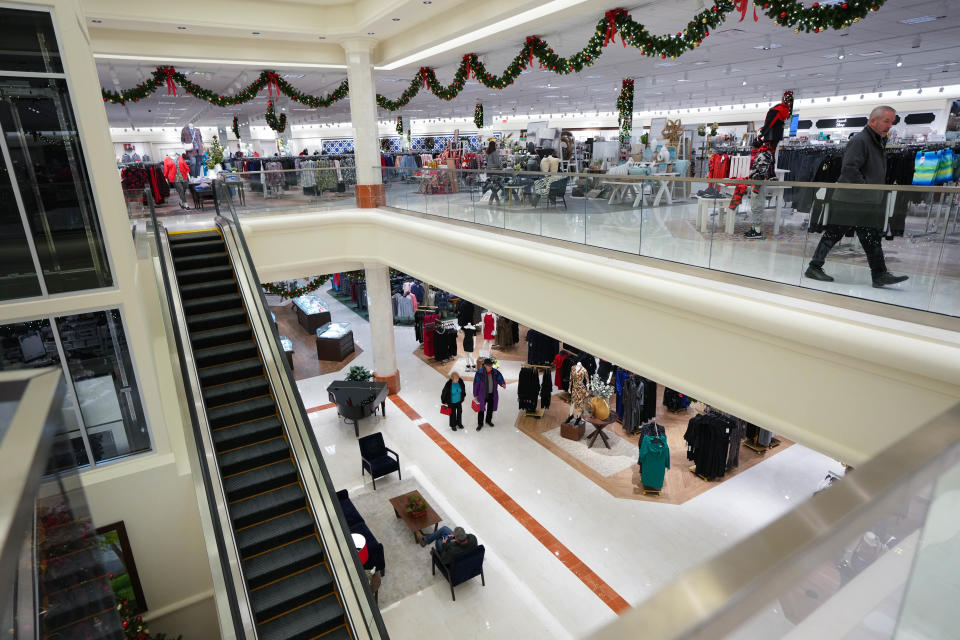 Trying to get ahead of potential weather store closures, last-minute holiday shoppers swarm the Von Maur store in Jordan Creek Town Center on Wednesday.