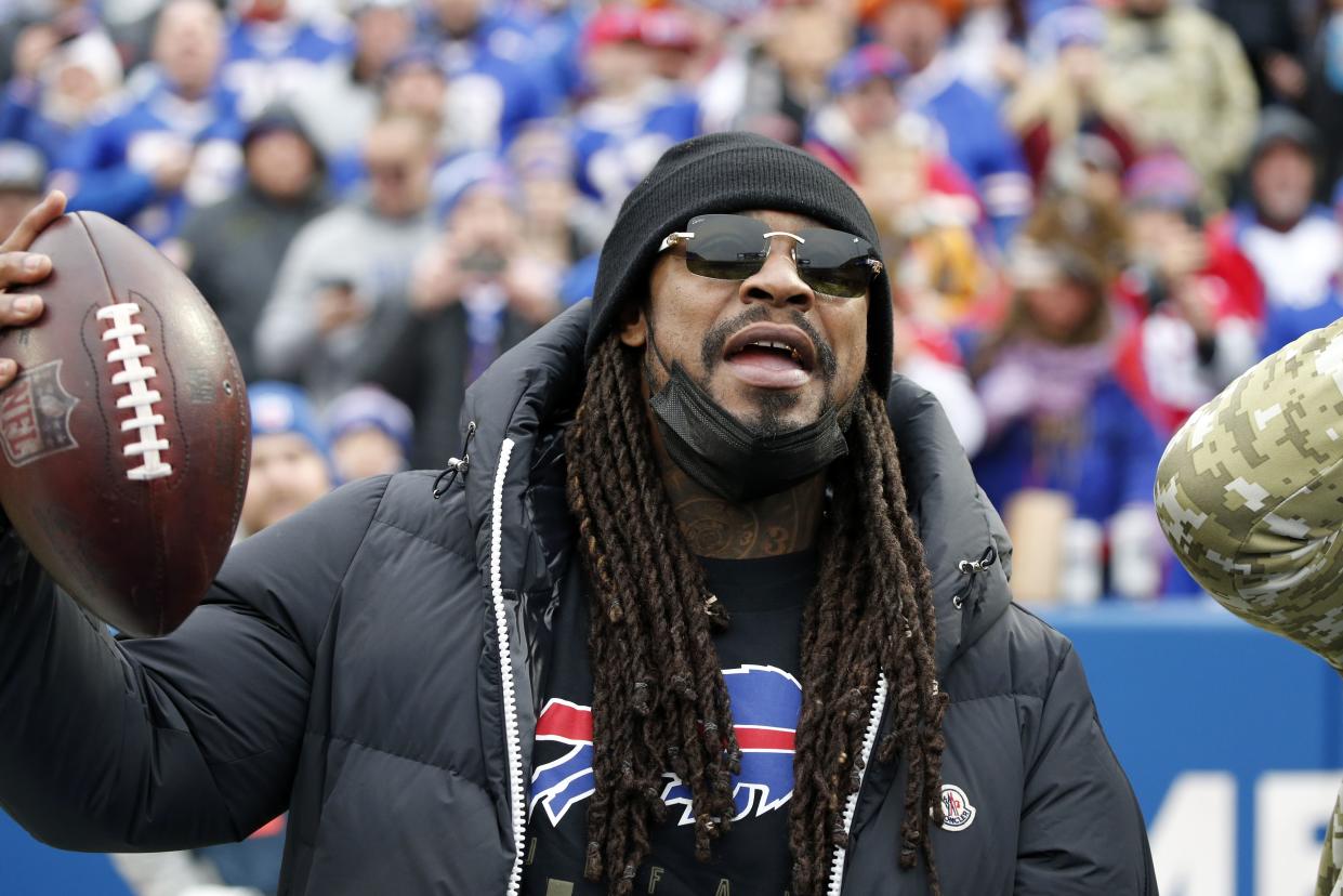 Marshawn Lynch participates in pre-game activities before an NFL football game between the Buffalo Bills and the Indianapolis Colts in Orchard Park, N.Y., Sunday, Nov. 21, 2021.