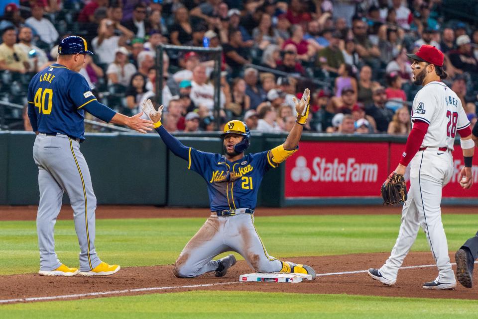 Jackson Chourio reacts after hitting a triple against the Diamondbacks.