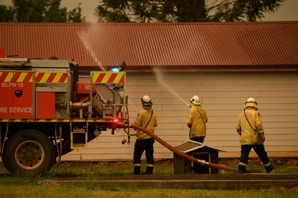 NSW Rural Fire Service crews protect property as the Gospers Mountain Fire approaches Bilpin.