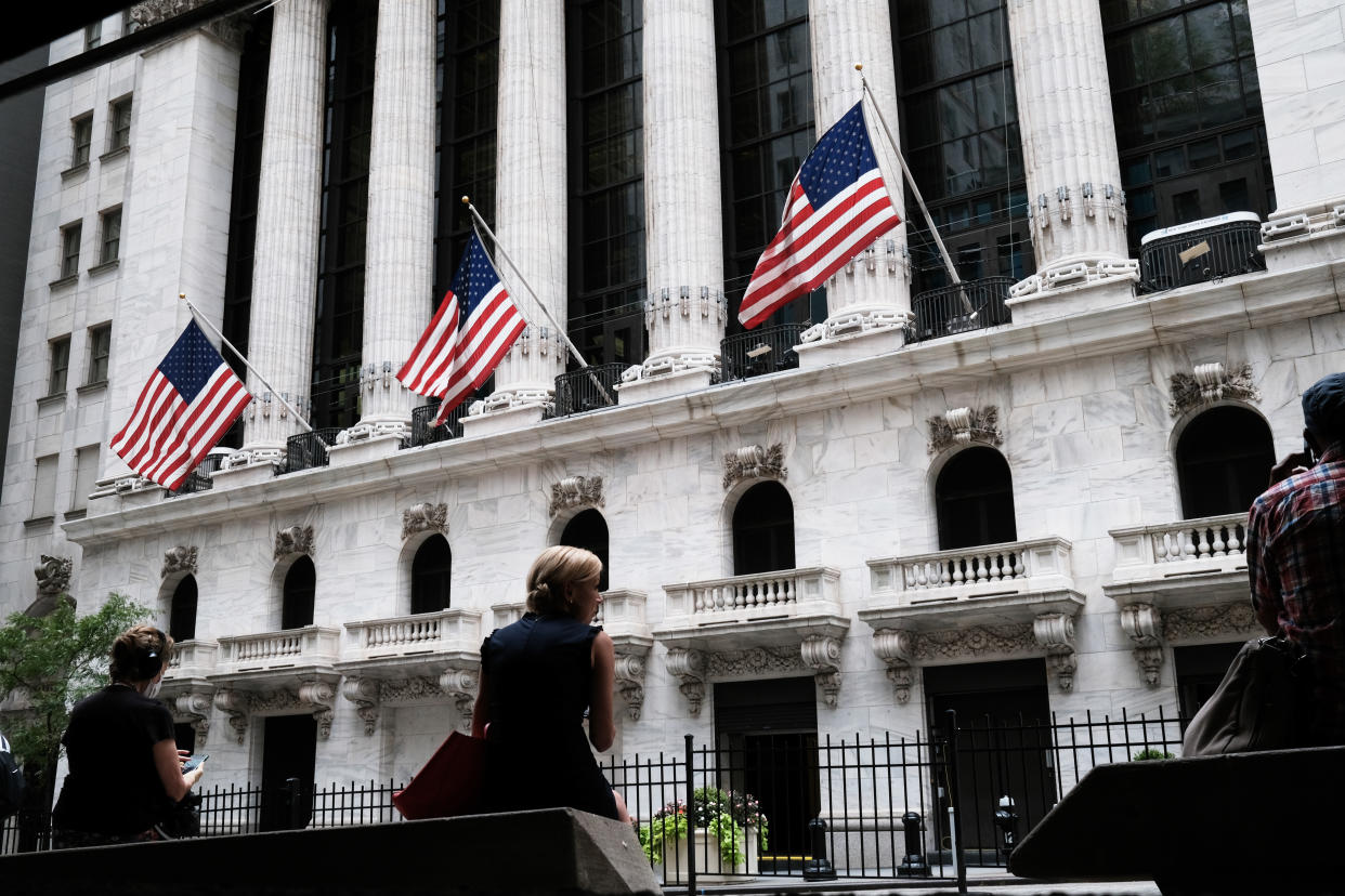 NEW YORK, NEW YORK - SEPTEMBER 16: People sit by the New York Stock Exchange (NYSE) on September 16, 2021 in New York City. Despite a rise in retail sales, the Dow slipped lower on Thursday as investors continue to have concerns from the Delta variant and news of a slight rise in jobless claims.  (Photo by Spencer Platt/Getty Images)