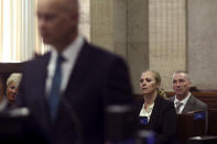 Tiffany Van Dyke, wife of Chicago Police Officer Jason Van Dyke, right, listens as special prosecutor Joe McMahon addresses the court regarding a previous ruling made by Cook County Judge Vincent Gaughan during the trial for the shooting death of Laquan McDonald by officer Van Dyke at the Leighton Criminal Court Building Wednesday, Sept. 19, 2018, in Chicago. (John J. Kim/Chicago Tribune via AP, Pool)