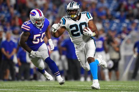 Aug 9, 2018; Orchard Park, NY, USA; Carolina Panthers running back C.J. Anderson (20) runs with the ball in front of Buffalo Bills linebacker Ramon Humber (50) during the third quarter at New Era Field. Rich Barnes-USA TODAY Sports