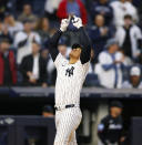 New York Yankees' Juan Soto reacts after hitting a home run against the Miami Marlins during the fourth inning of a baseball game, Monday, April 8, 2024, in New York. (AP Photo/Noah K. Murray)