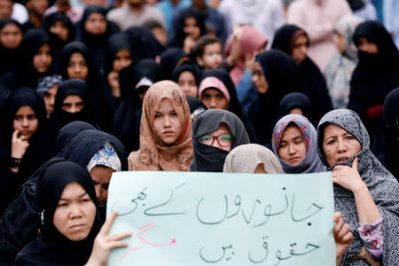 Pakistani Shi'ite supporters of Imamia Students Organization (ISO) hold a sign to condemn the Friday's blast at vegetable market in Quetta, during a protest in Karachi, Pakistan April 14, 2019. REUTERS/Akhtar Soomro