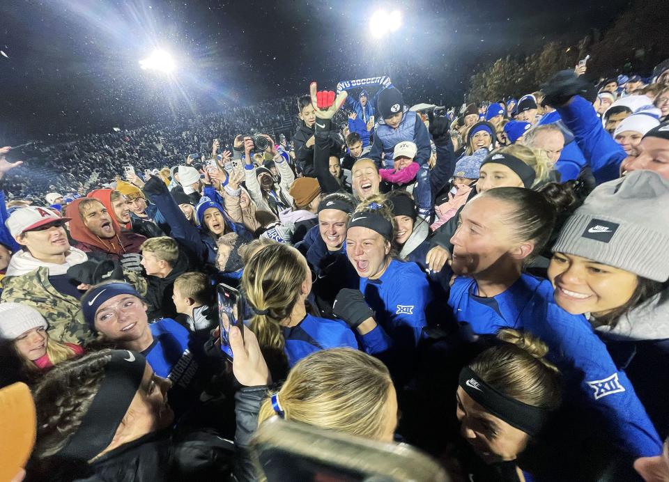 BYU players celebrate their win over UNC with fans after the NCAA tournament quarterfinals in Provo on Friday, Nov. 24, 2023. BYU won 4-3. | Jeffrey D. Allred, Deseret News