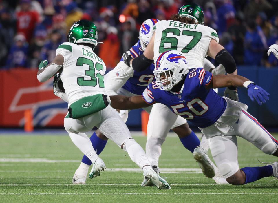 Bills Greg Rousseau   makes the play on Jets running back Michael Carter. 