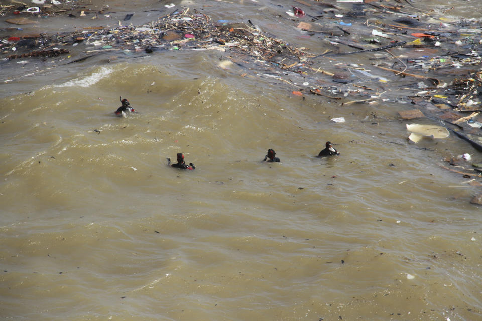 Divers look for flash flood victims in the city of Derna, Libya, Monday,., Sept. 18, 2023. Mediterranean storm Daniel caused flooding that overwhelmed two dams, sending a wall of water through the city. More than 10,000 were killed, and another 10,000 are missing. (AP Photo/Yousef Murad)