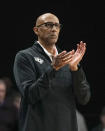 Central Florida head coach Johnny Dawkins encourages his players during the first half of an NCAA college basketball game against Kansas, Wednesday, Jan. 10, 2024, in Orlando, Fla. (AP Photo/John Raoux)