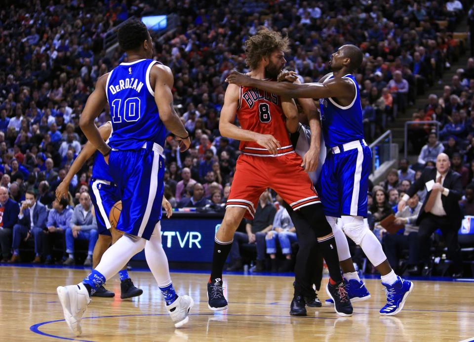 <p>Robin Lopez #8 of the Chicago Bulls fights with Serge Ibaka #9 of the Toronto Raptors during the second half of an NBA game at Air Canada Centre on March 21, 2017 in Toronto, Canada. NOTE TO USER: User expressly acknowledges and agrees that, by downloading and or using this photograph, User is consenting to the terms and conditions of the Getty Images License Agreement. (Photo by Vaughn Ridley/Getty Images) </p>