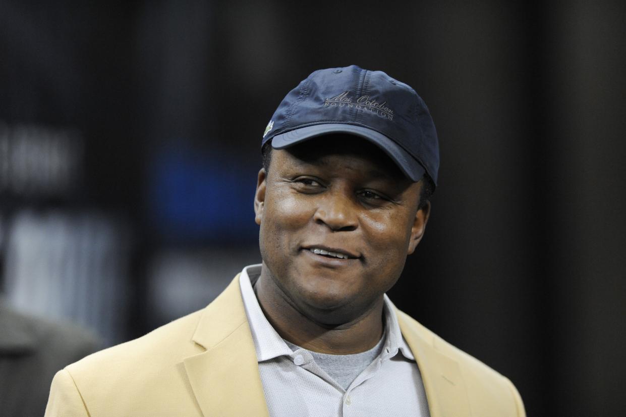 From left Detroit Lions running back Barry Sanders is seen before receiving a Pro Football Hall of Fame ring during a ceremony at halftime of an NFL football game between the Detroit Lions and the Chicago Bears, Sunday, Oct. 18, 2015, in Detroit. (AP Photo/Jose Juarez)