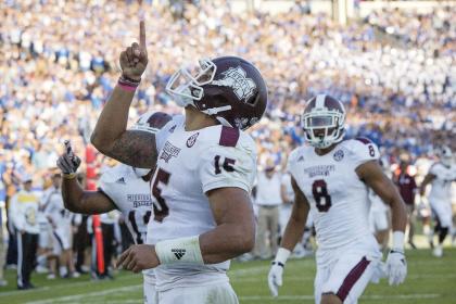 Dak Prescott and Mississippi State sit atop the first version of the College Football Playoff rankings. (AP)