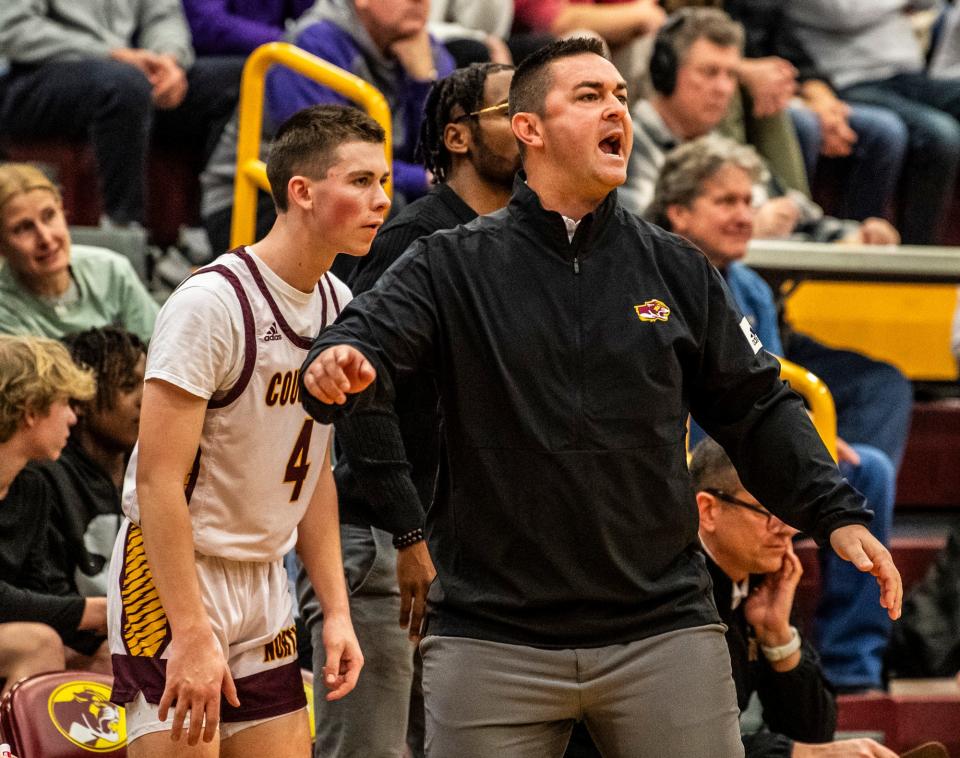 North Associate Head Coach Anthony Lindsey instructs his team during the Bloomington North versus Bloomington South boys basketball game at Bloomington High School North on Friday, Jan. 5, 2024. North won the game 56-53.