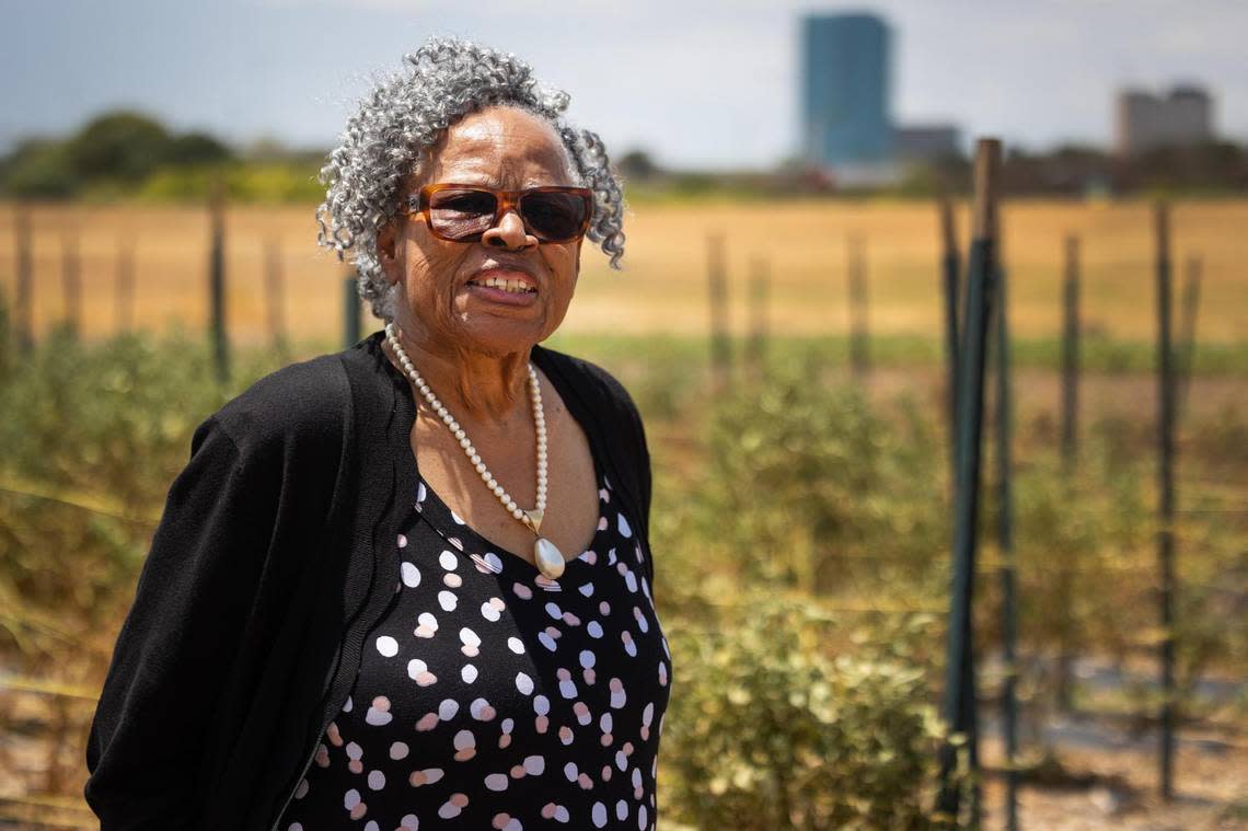 Opal Lee walks near the rows of vegetables planted at Opal’s Farm on Aug. 10 in Fort Worth. The farm is located along the Trinity River and operated through a special permit from the Tarrant Regional Water District.