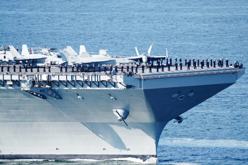 This photograph taken on May 24, 2023 shows the U.S. aircraft carrier USS <em>Gerald R. Ford</em> cruising near Jeloya island, in Moss, south of Oslo. <em>Photo by TERJE PEDERSEN/NTB/AFP via Getty Images</em>