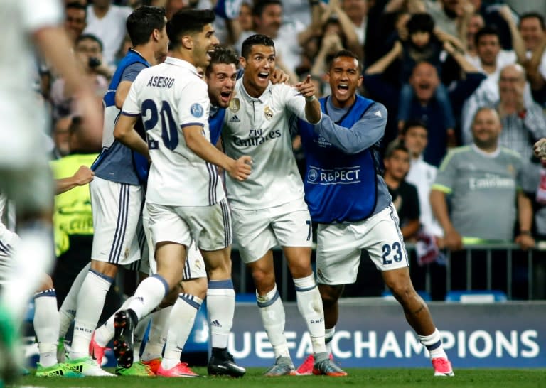 Real Madrid's forward Cristiano Ronaldo (2R) celebrates a goal during the UEFA Champions League quarter-final second leg football match Real Madrid vs FC Bayern Munich at the Santiago Bernabeu stadium in Madrid in Madrid on April 18, 2017