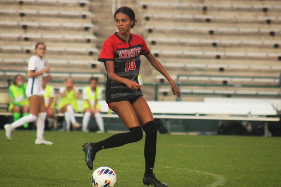 Creekside midfielder Avery Robinson (10) cuts back with the ball against Boca Raton in the Class 7A final.