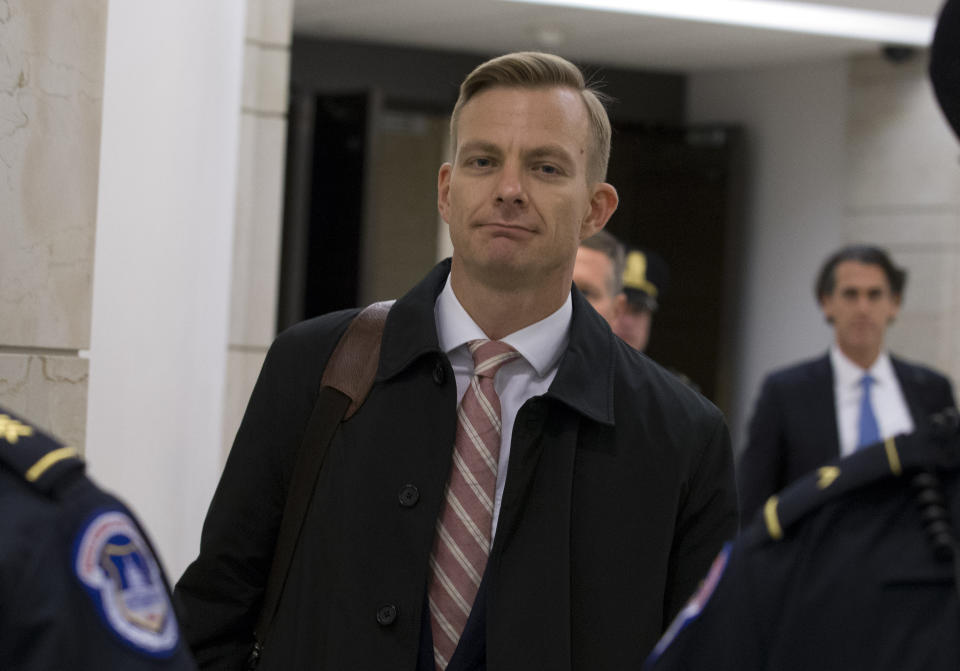 David Holmes, a career diplomat and the political counselor at the U.S. Embassy in Ukaine leaves the Capitol Hill, Friday, Nov. 15, 2019, in Washington, after a deposition before congressional lawmakers as part of the House impeachment inquiry into President Donald Trump. (AP Photo/Jose Luis Magana)