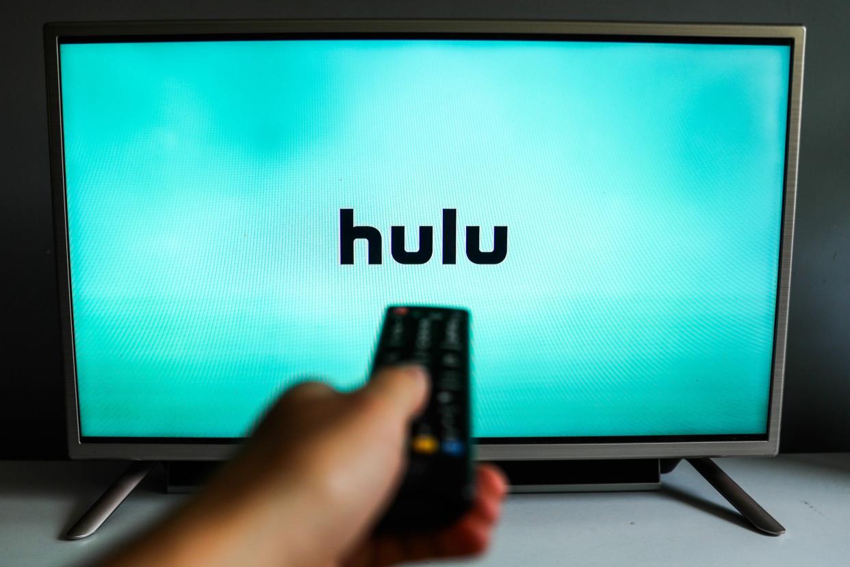 Hulu subscription on TV with watcher using remote