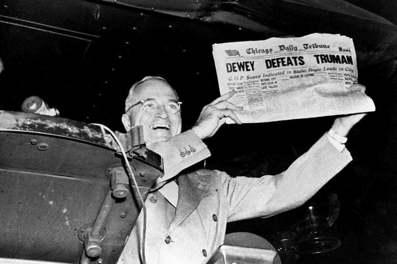 President-elect Harry S. Truman laughs heartily as he holds an early edition of the Chicago Tribune for November 3, 1948, with the headline “Dewey Defeats Truman.” The newspaper, whose headline jumped to an erroneous conclusion as early election returns came in, was shown to Truman as he stopped in St. Louis during his victorious return trip to Washington, D.C. File Photo by Frank Cancellare/UPI