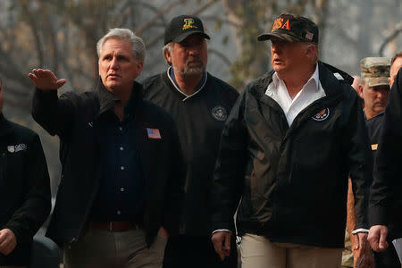 U.S. House Majority Leader Rep. Kevin McCarthy points while walking with U.S. President Donald Trump and other officials while visiting the charred wreckage of Skyway Villa Mobile Home and RV Park in Paradise, California, U.S., November 17, 2018. REUTERS/Leah Millis?