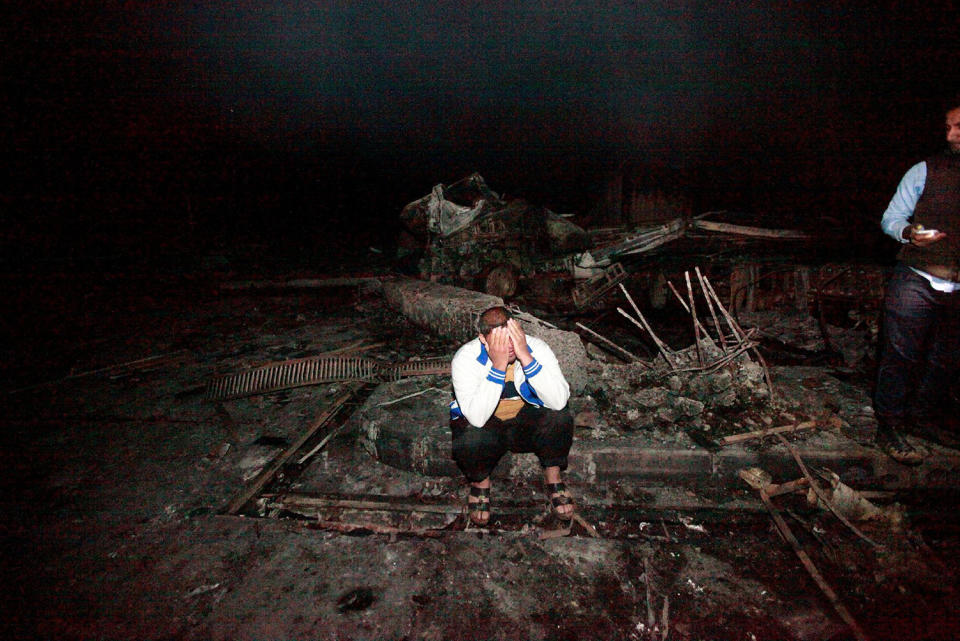 A man reacts after suicide truck bomb attack