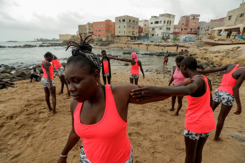 Wider Image: Meet Senegal's first female pro surfer inspiring girls to take to the waves