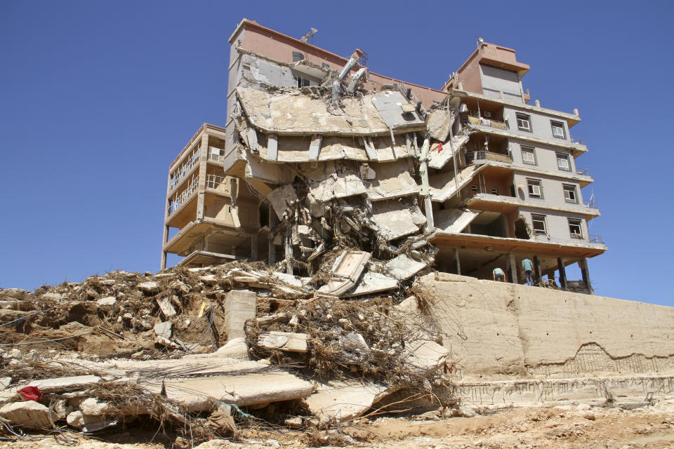 Damage from massive flooding is seen in Derna, Libya, Wednesday, Sept.13, 2023. Search teams are combing streets, wrecked buildings, and even the sea to look for bodies in Derna, where the collapse of two dams unleashed a massive flash flood that killed thousands of people. (AP Photo/Yousef Murad)