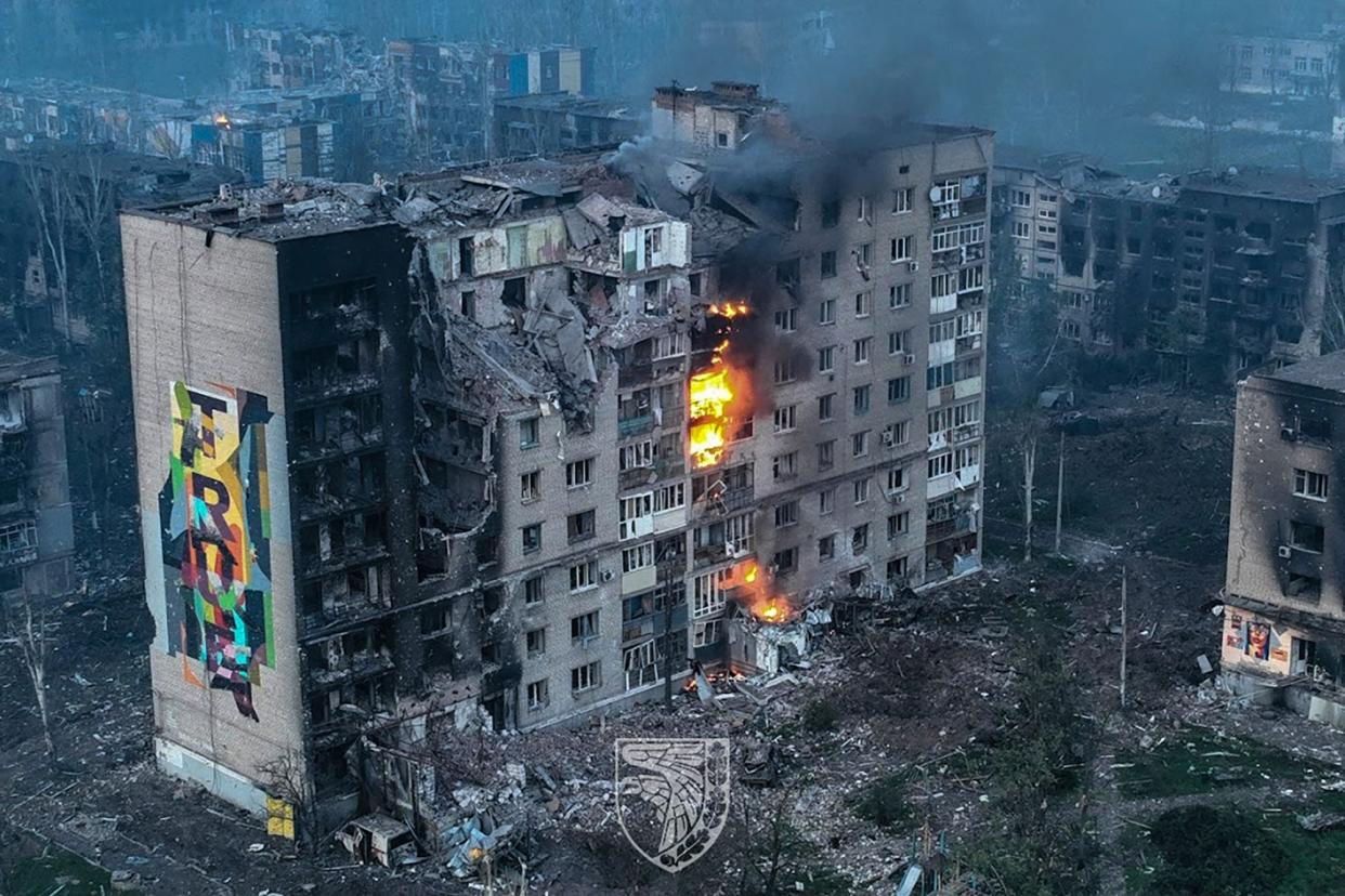 An apartment block on fire in the city of Bakhmut, Donetsk region (Armed Forces of Ukraine/AFP via)