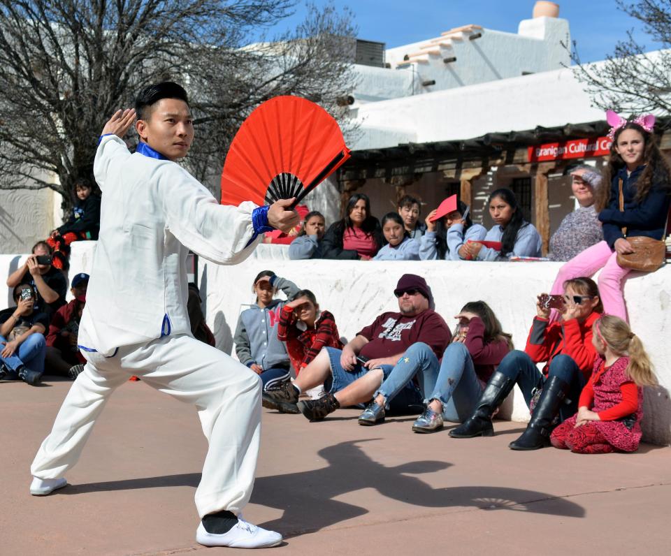 Professor Chao Liu — visiting New Mexico State University from Tianjin, China — performs on Saturday a dance called Tai Chi Fun as part of the Lunar New Year Fair celebrating the Year of the Pig. The fair, presented by NMSU's Confucius Institute, included activities and presentations at Branigan Cultural Center.