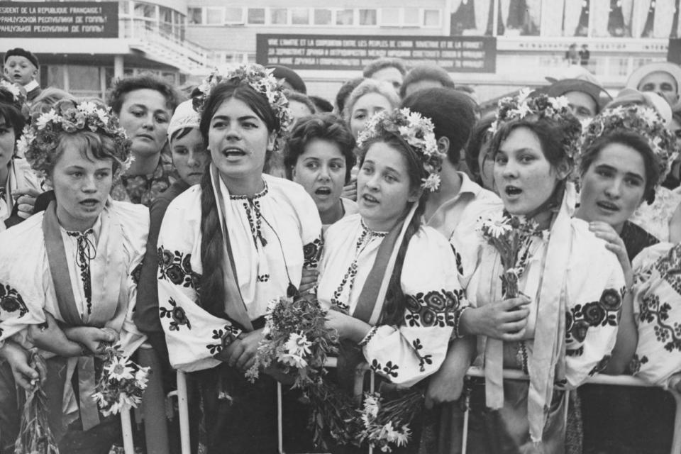 Young Ukrainian women, in traditional clothes, awaiting the arrival of President de Gaulle of France during the third leg of his visit to the Soviet Union, in Kyiv, Ukraine on June 27, 1966. (Agence France Presse/Archive Photos/Hulton Archive/Getty Images)