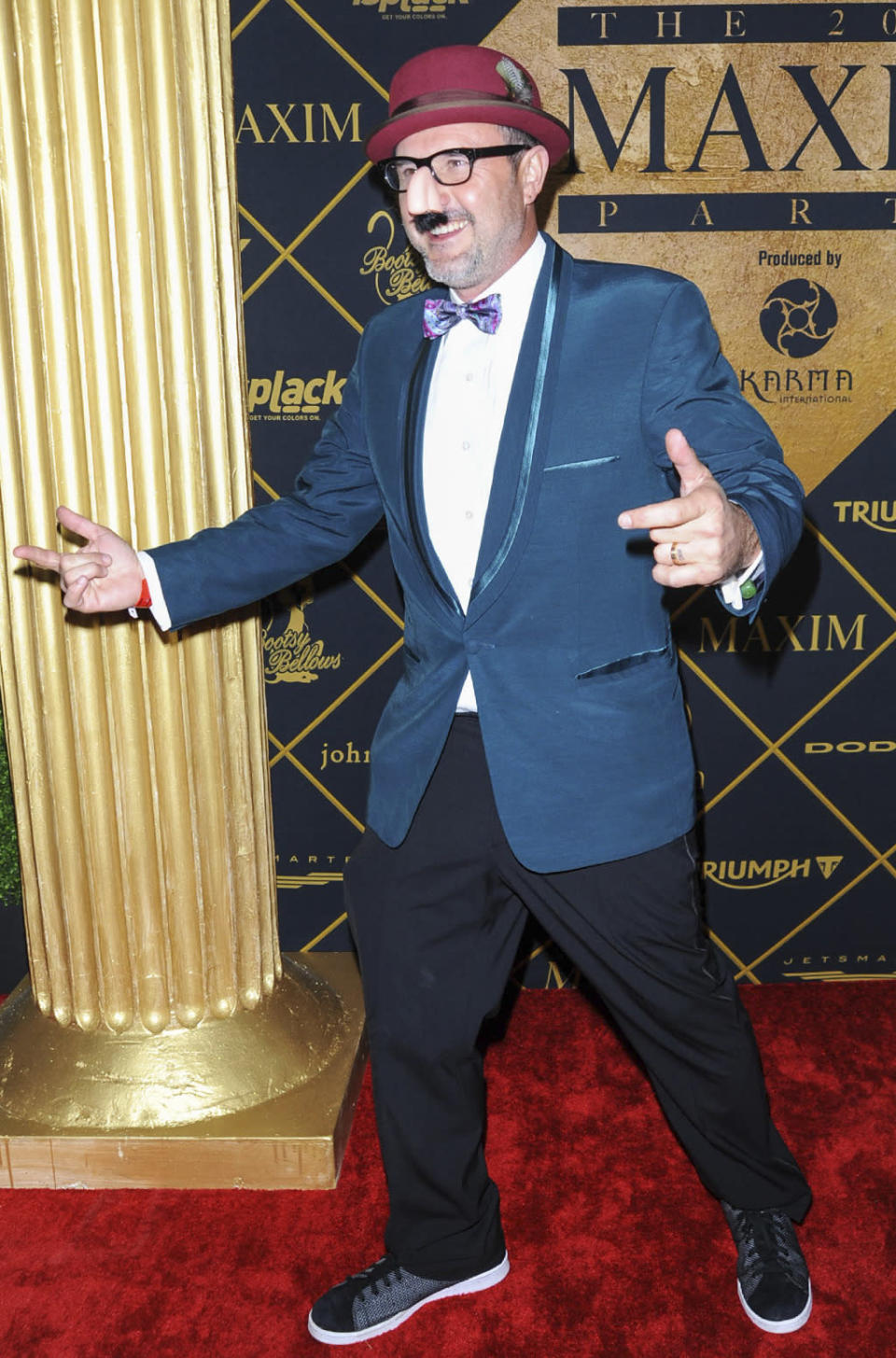 Oh, David Arquette! The actor clowned around at a party hosted by Maxim and Bootsy Bellows.  (Photo: Lilly Lawrence/Getty Images)