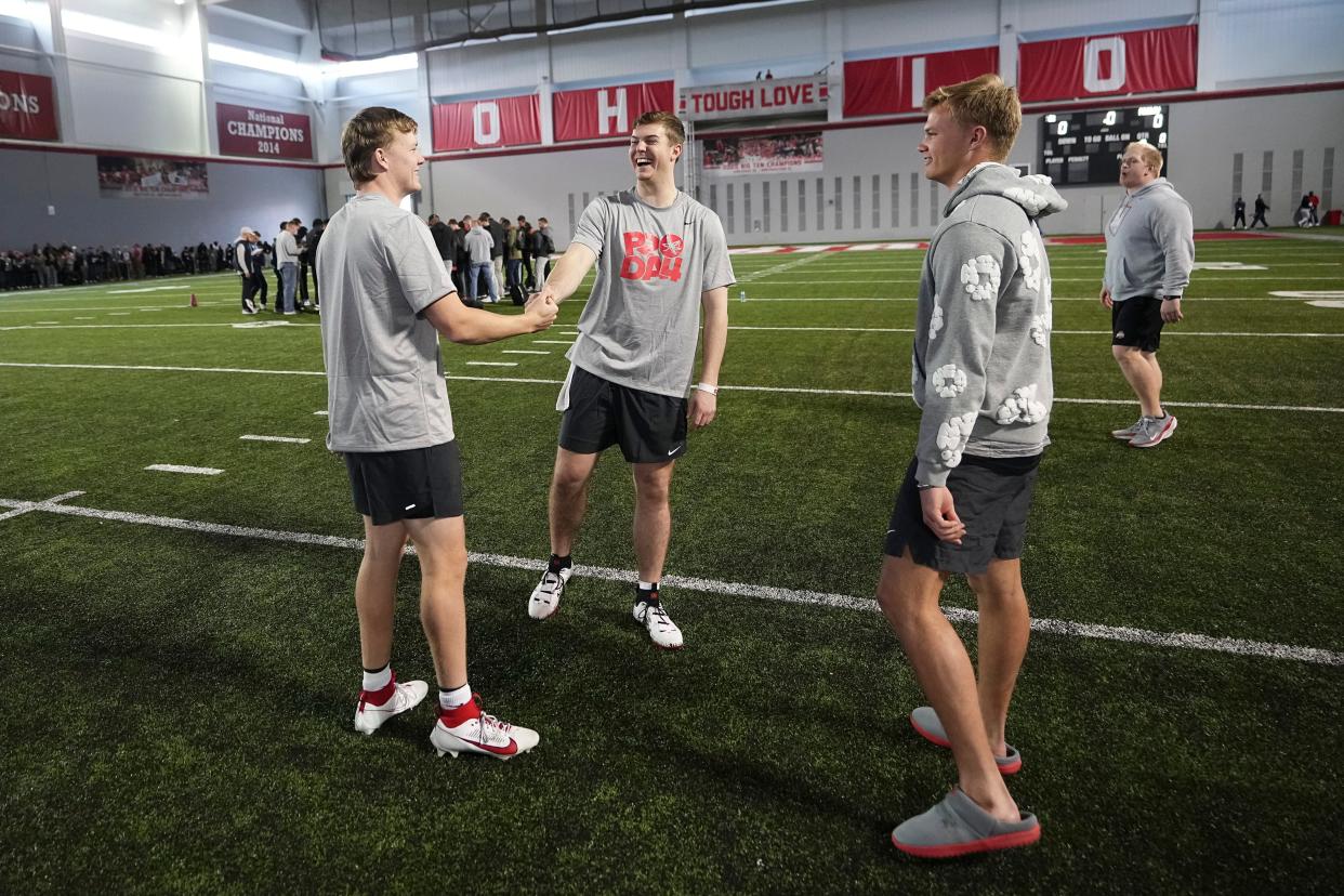 Ohio State quarterbacks, from left, Devin Brown, Will Howard and Lincoln Kienholz.