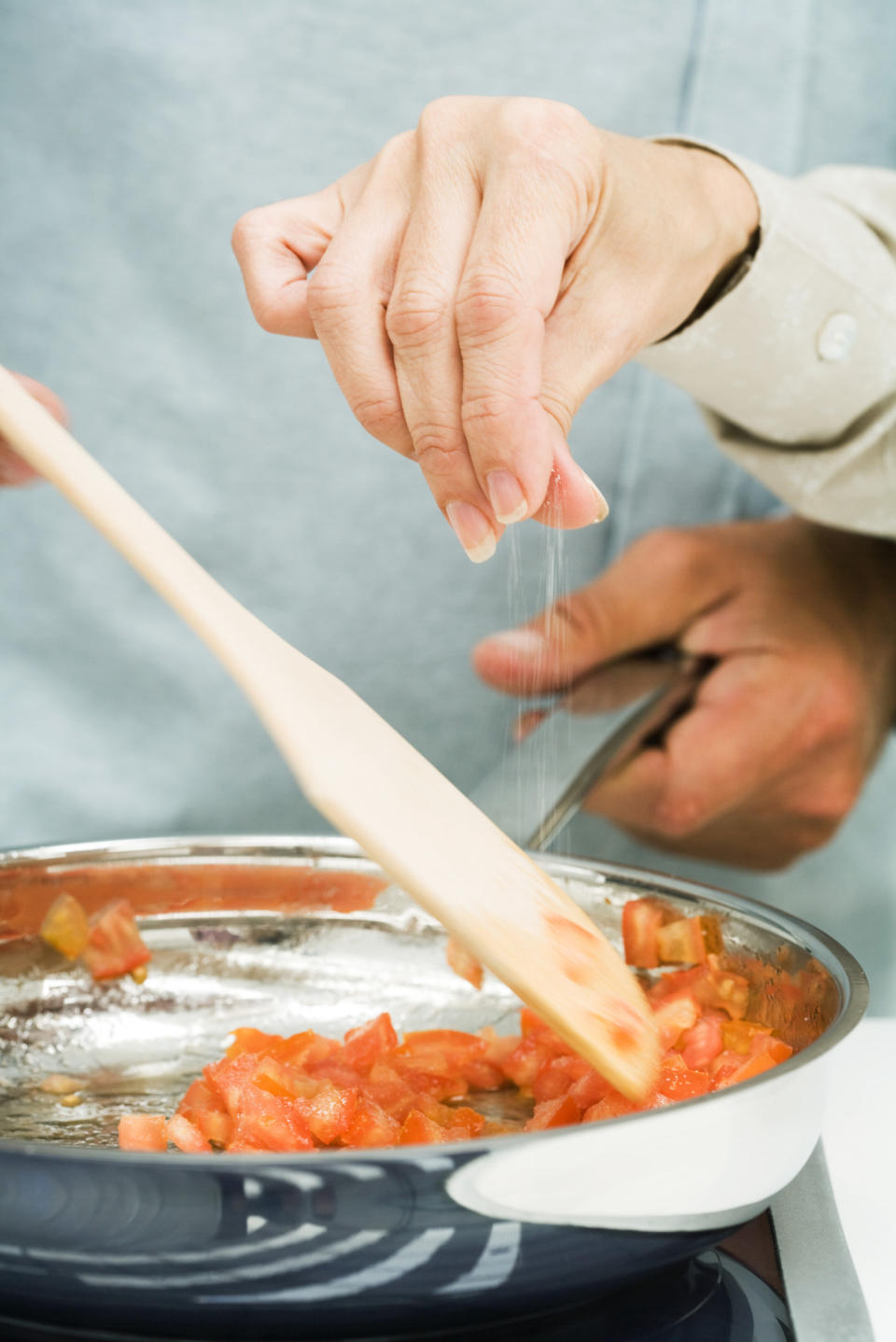 Sprinkling salt into a pan