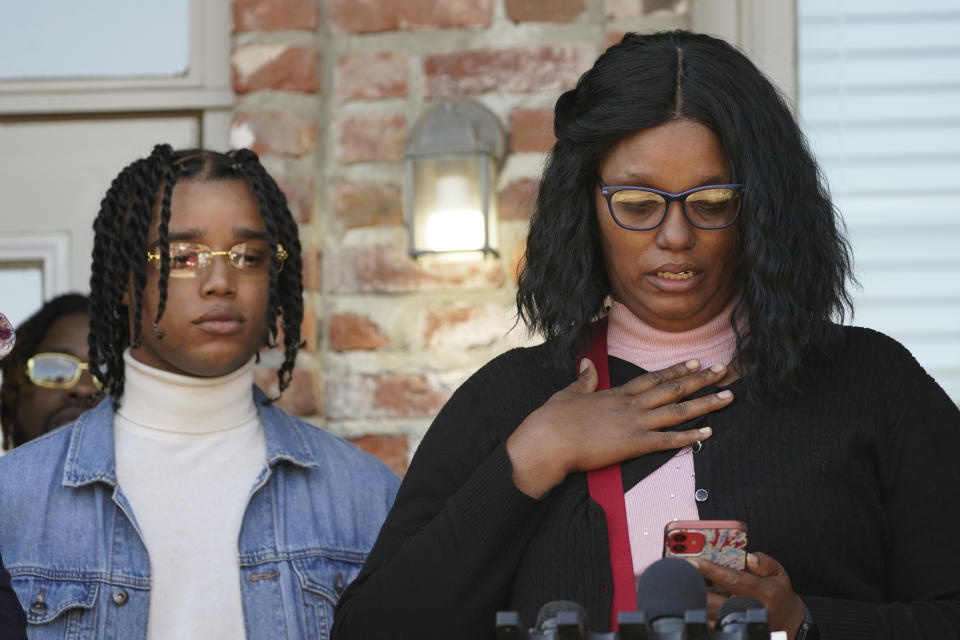FedEx driver Demonterrio Gibson, left, listens to his mother, Sharon McClendon speak about her reaction upon hearing about the alleged assault on her son during a news conference in Ridgeland, Miss., Thursday, Feb. 10, 2022. Gibson and his attorneys say the delivery driver was shot at and chased by a white father and son in Brookhaven while making deliveries, and that both suspects have been "undercharged" and call upon the authorities to instead charge the pair with attempted murder and hate crimes. (AP Photo/Rogelio V. Solis)