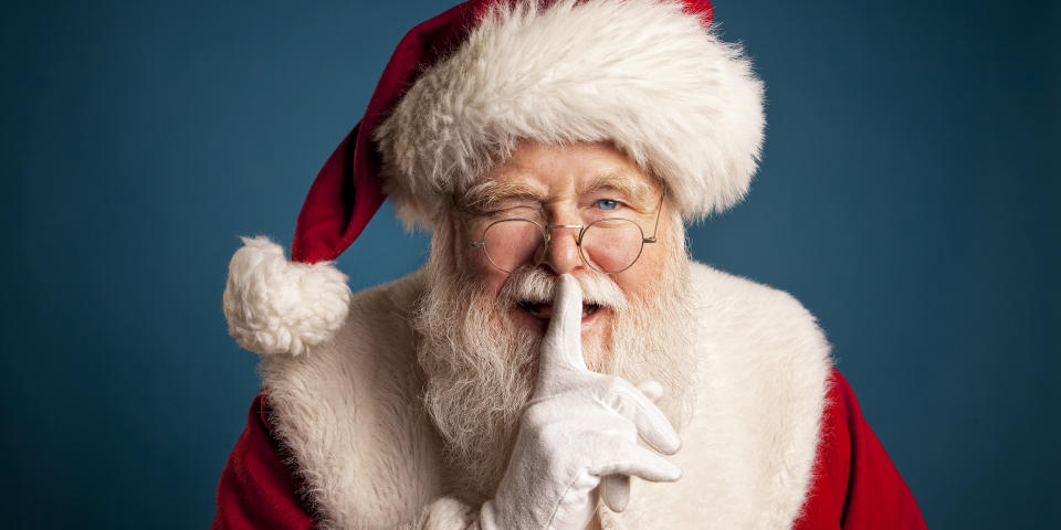 Pictures of Real Santa Claus with fingers on lips (inhauscreative / Getty Images)