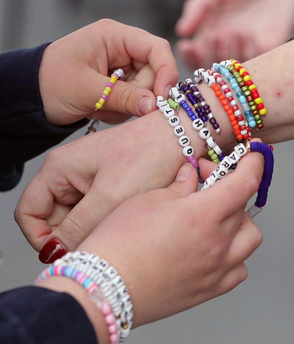 Swifties exchange friendship bracelets during Taylor Swift Fan Day at the Rock & Roll Hall of Fame in Cleveland Friday.