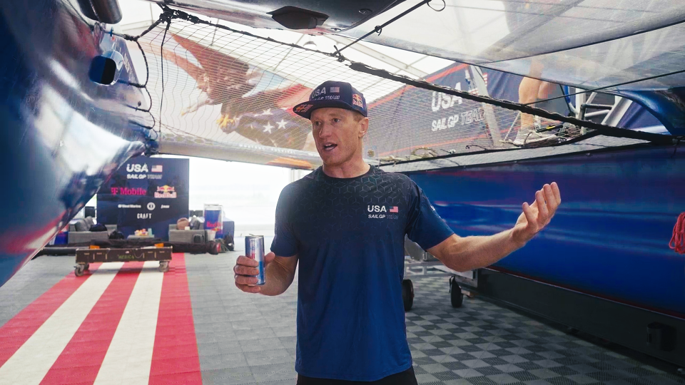 Jimmy Spithill stands next to Team USA's SailGP F50