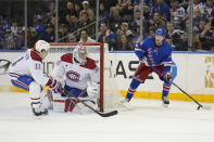 Montreal Canadiens right wing Brendan Gallagher (11) and goaltender Cayden Primeau (30) defend against New York Rangers left wing Alexis Lafrenière (13) during the first period of an NHL hockey game, Sunday, April 7, 2024, at Madison Square Garden in New York. (AP Photo/Mary Altaffer)