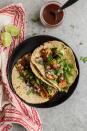 <p>These halloumi tacos are kept deliciously simple with a few greens, fried halloumi tossed in garlic and coriander, and topped with a sprinkle of onion and hot sauce.</p><p>Get the <a href="https://naturallyella.com/garlicky-halloumi-tacos/" rel="nofollow noopener" target="_blank" data-ylk="slk:Garlicky Halloumi Tacos;elm:context_link;itc:0;sec:content-canvas" class="link ">Garlicky Halloumi Tacos</a> recipe.</p><p>Recipe from <a href="https://naturallyella.com/" rel="nofollow noopener" target="_blank" data-ylk="slk:Naturally Ella;elm:context_link;itc:0;sec:content-canvas" class="link ">Naturally Ella</a>.</p>