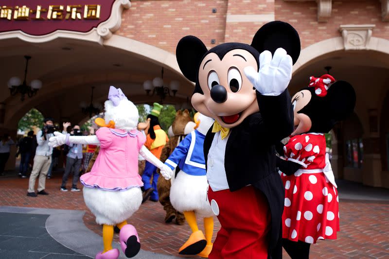 Disney character Mickey Mouse greets visitors at Shanghai Disney Resort as the Shanghai Disneyland theme park reopens following a shutdown due to the coronavirus disease (COVID-19) outbreak, in Shanghai