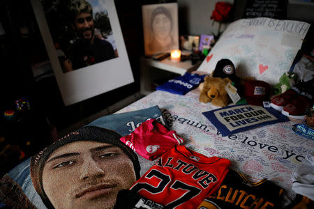 Autographed sports t-shirts, pictures and placards are seen among other mementoes at the room of Joaquin Oliver, one of the victims of the mass shooting at Marjory Stoneman Douglas High School, at his house in Parkland, Florida, U.S., April 11, 2018. REUTERS/Carlos Garcia Rawlins