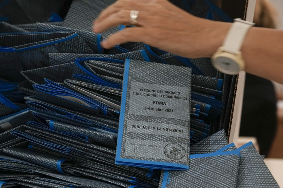 Scrutineers count ballots after the closing of a polling station, in Rome, Monday, Oct. 4, 2021. Ballot counting has begun in Italy following the end Monday of two days of voting for mayors in many cities (AP Photo/Andrew Medichini)