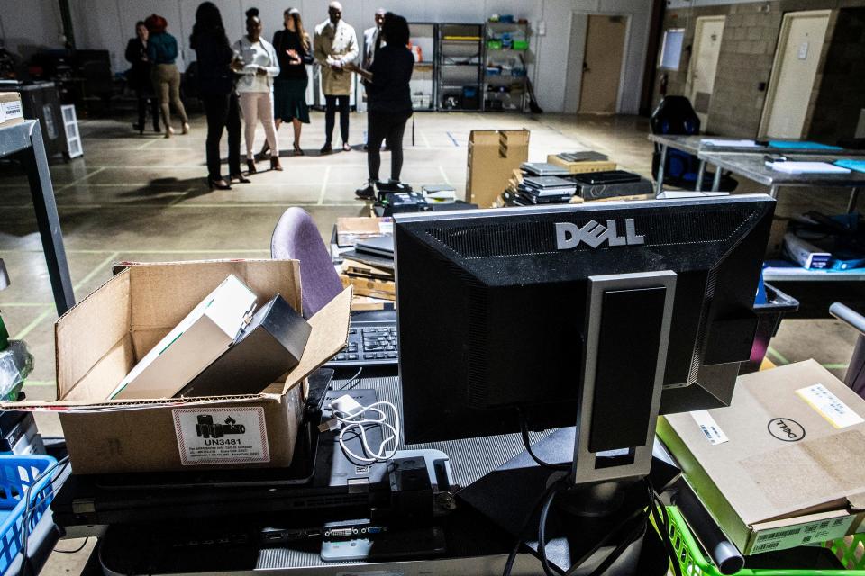 Visitors attend the grand opening of NERDiT NOW's 50,000-square-foot warehouse near East Side Charter School in Wilmington, Thursday, Dec. 8, 2022. NERDiT NOW is Delaware's only R2 certified electronics recycler and has received a lot of local recognition for its community initiatives and its training program.