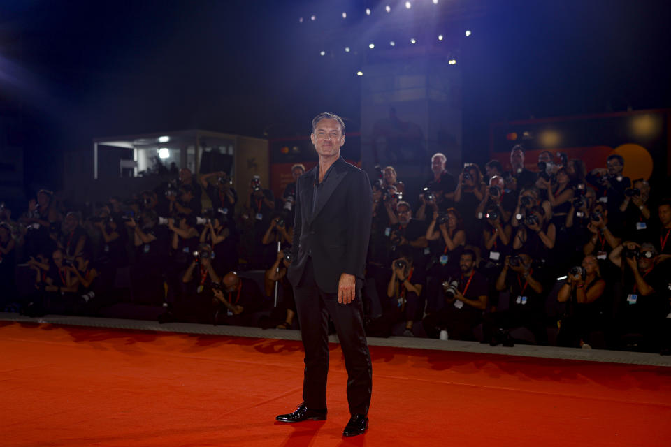 Jude Law poses for photographers upon arrival for the premiere of the film 'The Order' during the 81st edition of the Venice Film Festival in Venice, Italy, on Saturday, Aug. 31, 2024. (Photo by Vianney Le Caer/Invision/AP)