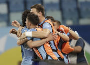 Uruguay's Edinson Cavani celebrates with his teammates after scoring his team's second goal against Bolivia during a Copa America soccer match at Arena Pantanal in Cuiaba, Brazil, Thursday, June 24, 2021. (AP Photo/Andre Penner)