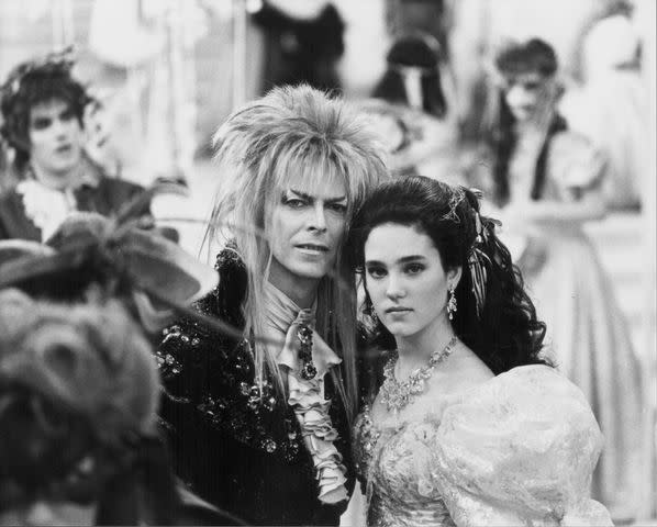 <p>Stanley Bielecki Movie Collection/Getty</p> David Bowie and Jennifer Connelly in <em>Labyrinth</em> (1986)
