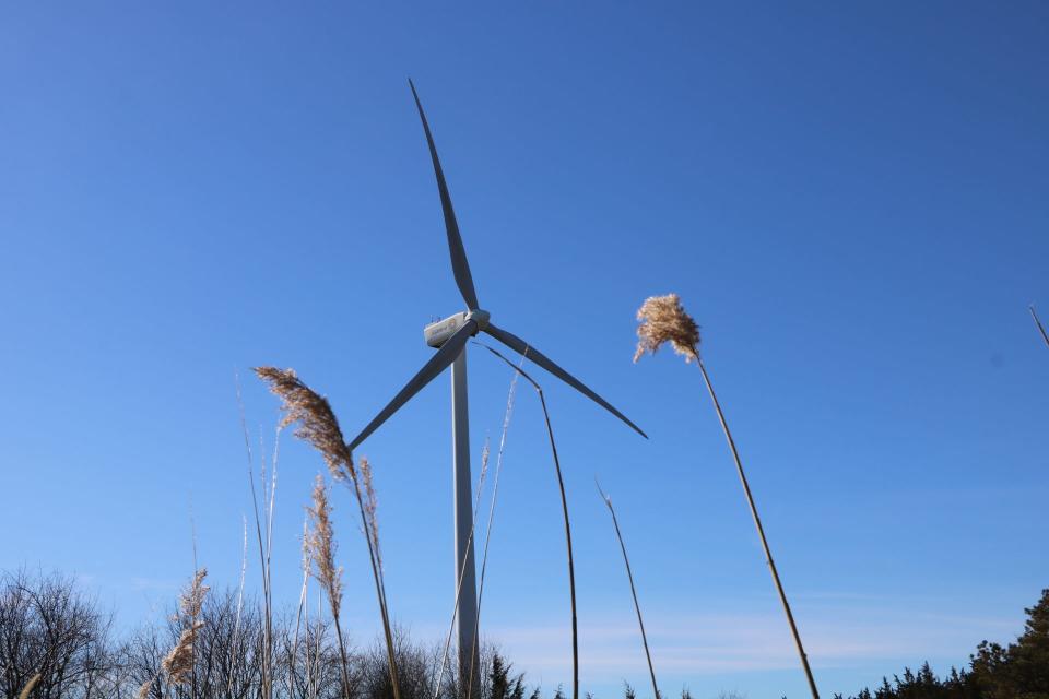 A two megawatt turbines spins in the breeze by the University of Delaware's campus in Lewes. The wind turbine is less than half the size of the larger 12 megawatt wind turbine Orsted plans to use off the coast of Delaware for its Skipjack Wind Farm project.