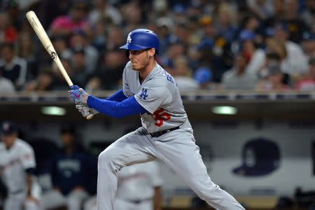 Jul 11, 2018; San Diego, CA, USA; Los Angeles Dodgers center fielder Cody Bellinger (35) singles to the left side of the infield to beat the shift in the eighth inning against the San Diego Padres at Petco Park. Mandatory Credit: Jake Roth-USA TODAY Sports