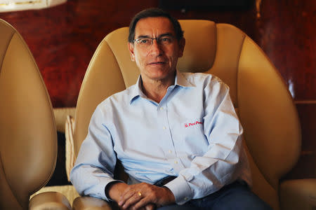 Peru's President Martin Vizcarra speaks during an interview with Reuters on board the presidential plane returning from Madre de Dios to Lima, Peru May 17, 2019. REUTERS/Guadalupe Pardo